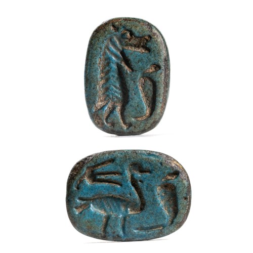 A New-Kingdom blue faience scaraboid engraved seal.